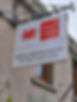 Sign on a textured wall for "Tafarn Cefn Hafod" bar and restaurant, featuring a red Welsh dragon and contact number