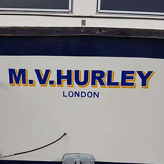 Boat name "M.V. Hurley" in bold blue and yellow letters, with "London" in smaller blue font beneath