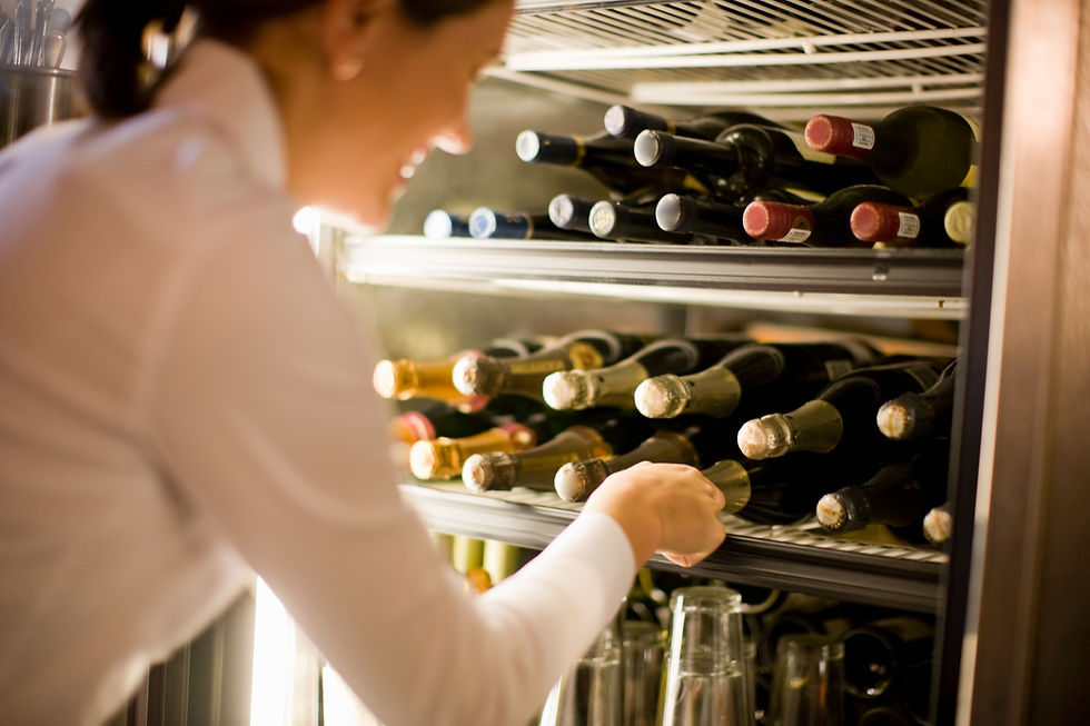 Waitress reaching for champagne
