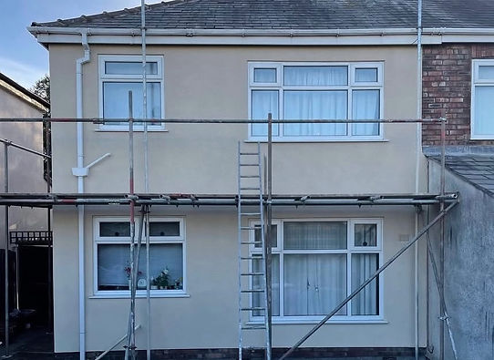 Scaffolding on property exterior for spray cork application work