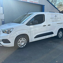 White commercial van parked outside