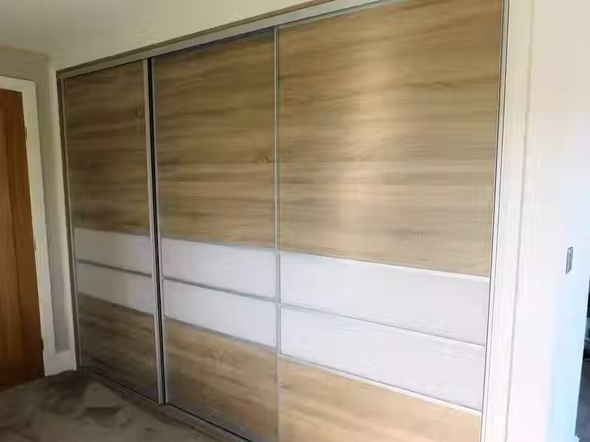 Sliding wardrobe with wooden panels