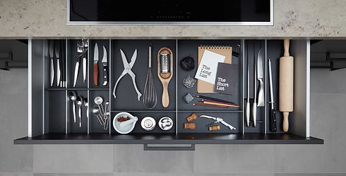 Sleek dark charcoal kitchen cabinetry paired with an integrated island