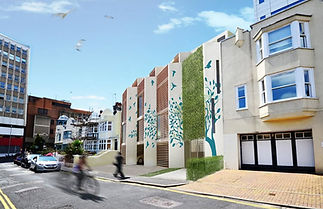 Modern building with tree and bird mural on a sunny street. Vertical wooden slats
