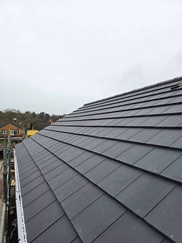 A roof featuring a sleek black metal roofing system, showcasing a modern and durable design