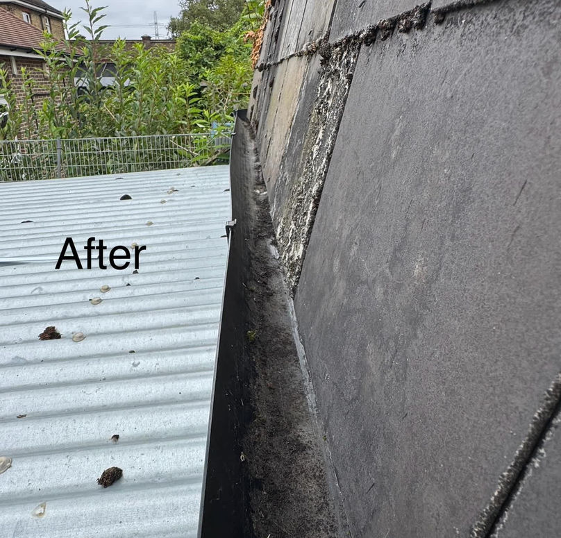 Corrugated metal roof next to cleaned brick wall after repair