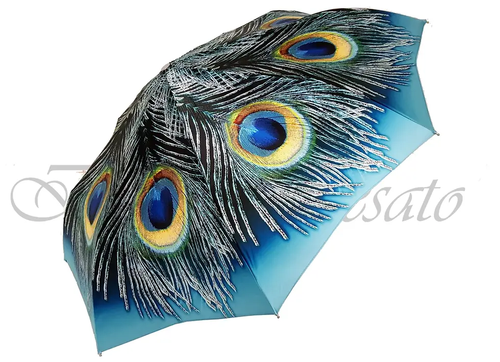 Blue and white peacock feather umbrella with water drops in a light background.