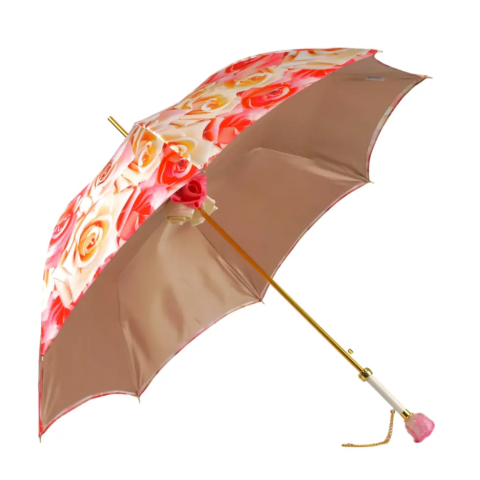 Open umbrella with floral pattern, beige and gold accents, white background.