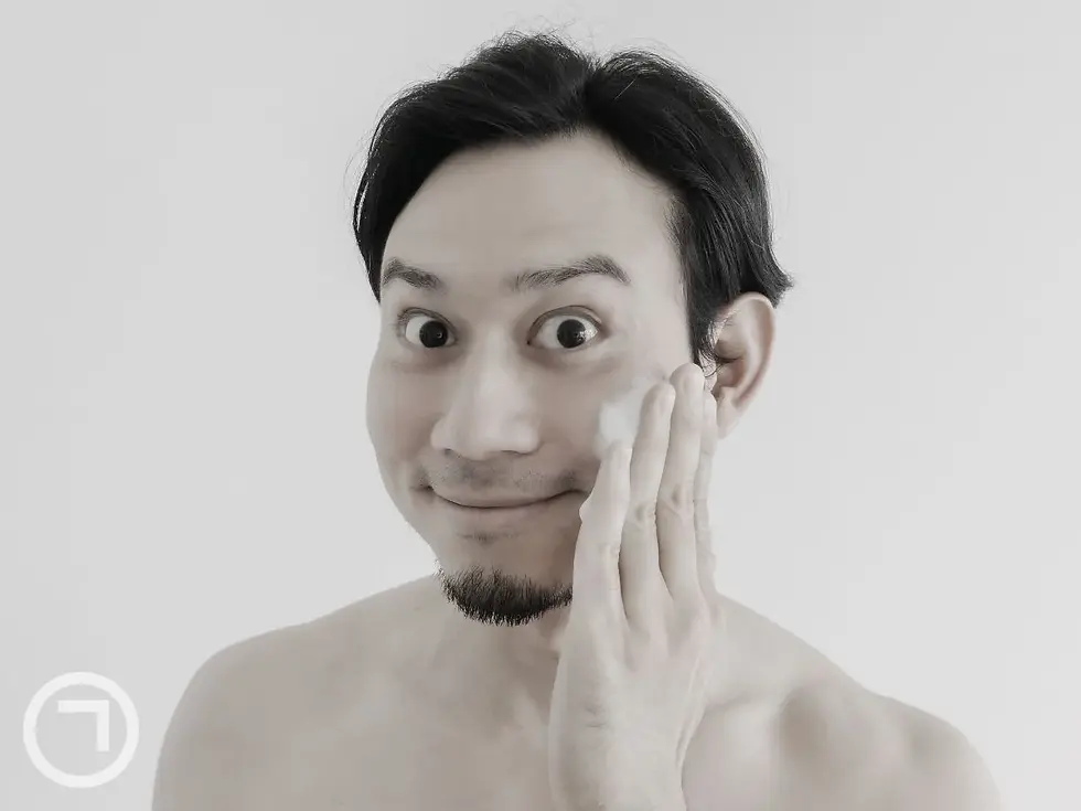 Man applying makeup