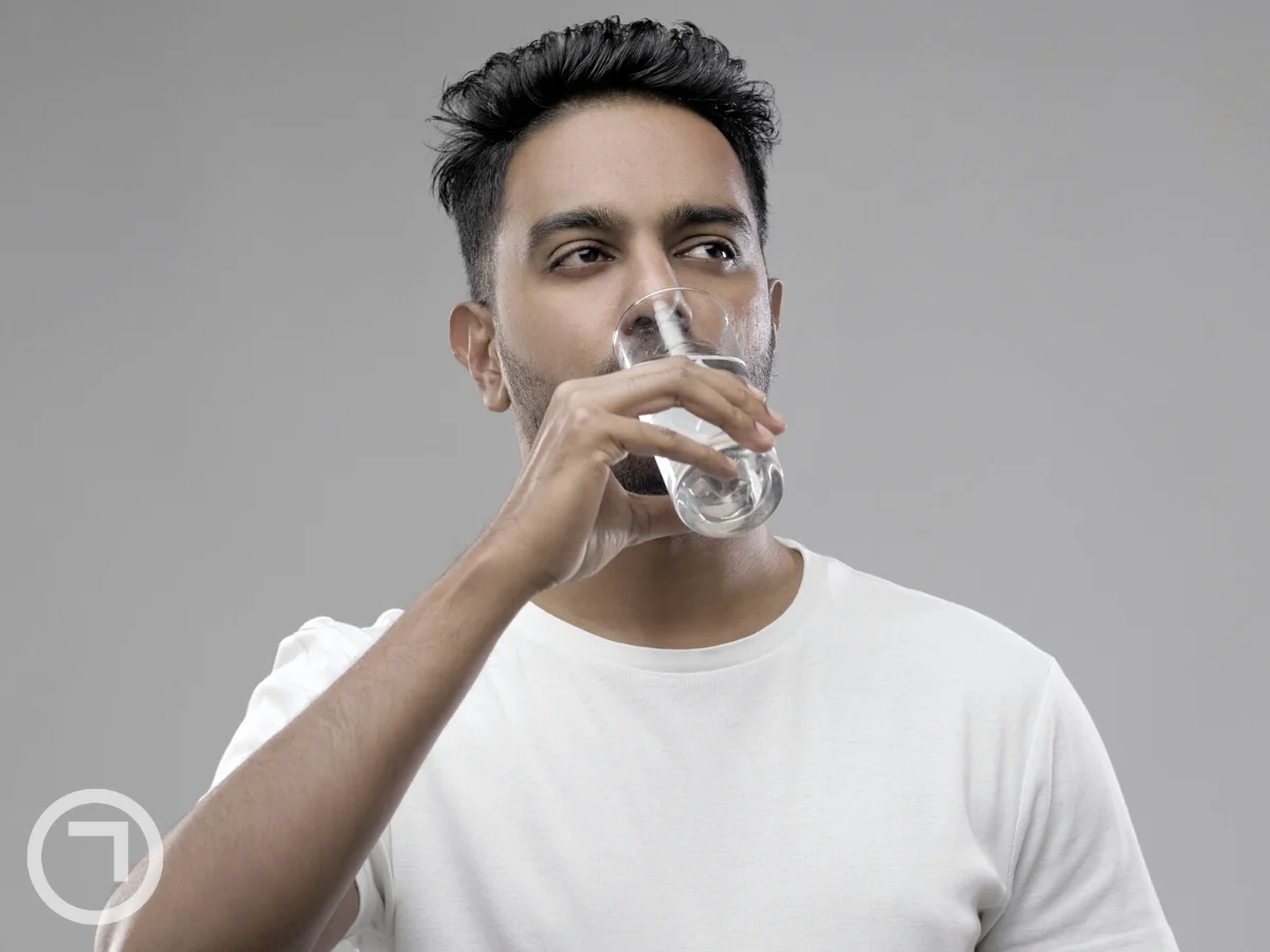 man drinking water