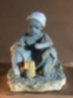  Tête d'enfant portant couronne terre cuite 