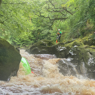 A paddler being Gobbled on Middle Conwy