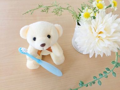 歯ブラシとクマのぬいぐるみ