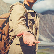 Young travel man lending a helping hand