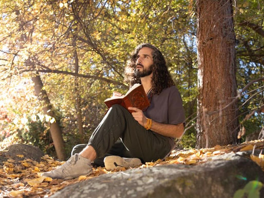 Ben journaling in the woods