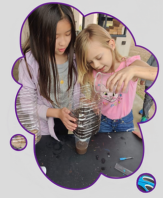 Students doing science experiment at Extraordinary Adventures Academy in Katy, TX