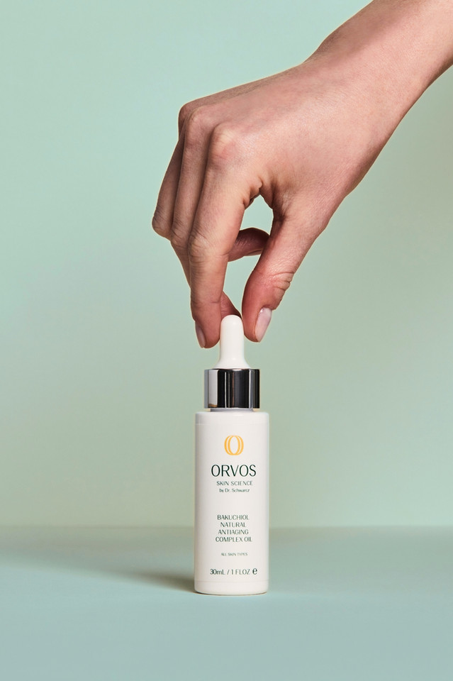 hand holding Orvos Bakuchiol Natural Antiaging Complex Oil