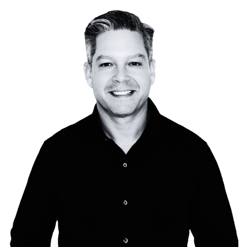 Black and white professional portrait of Dr. Robert Schwarcz, MD, smiling and wearing a dark button-up shirt.
