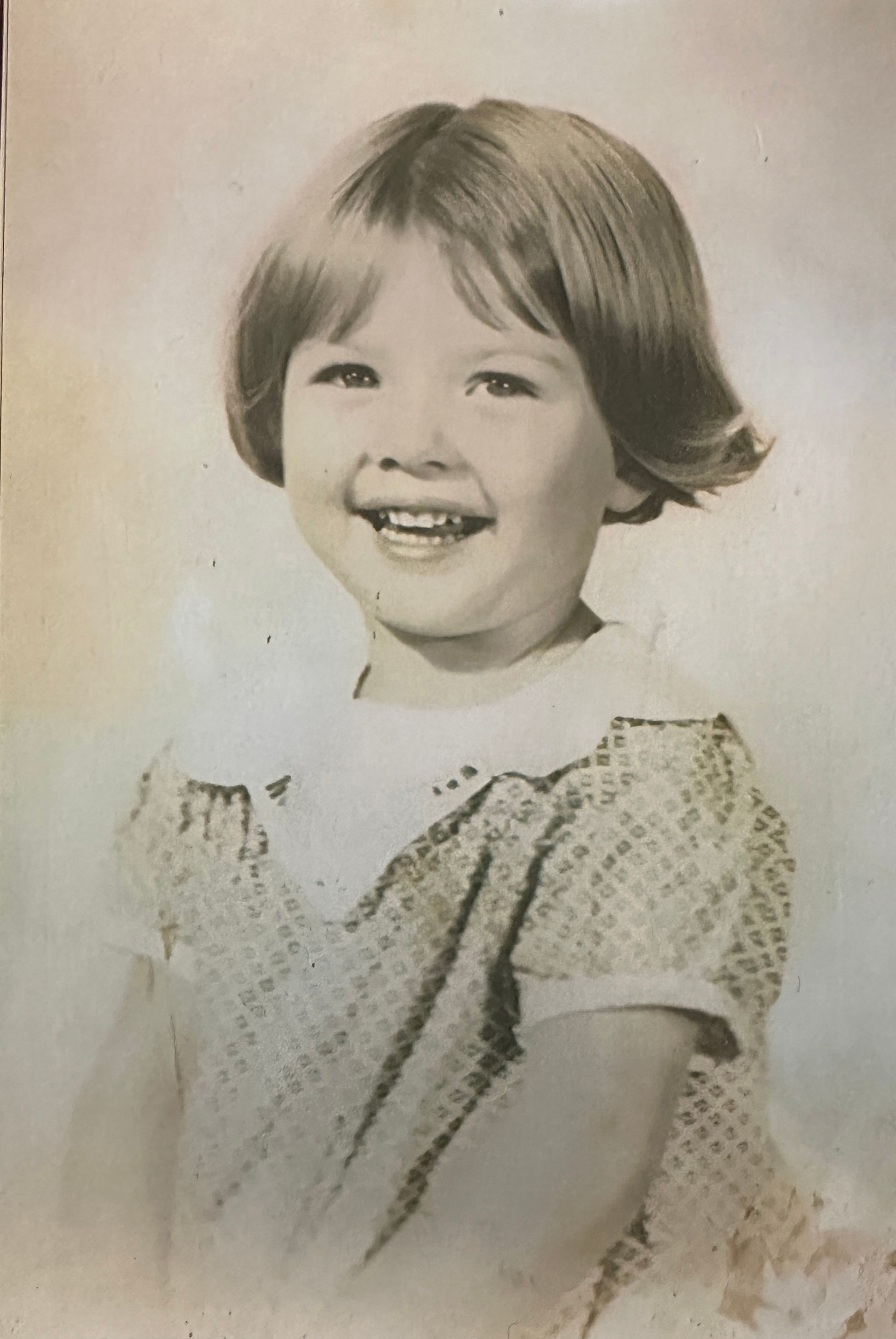 A portrait of a little girl from the 1930s.
