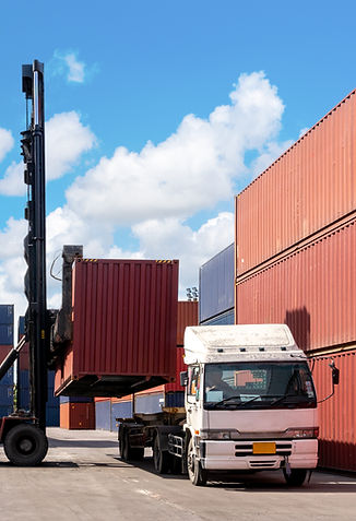 Foreman control loading Containers box from Cargo freight ship for import export. Logistic