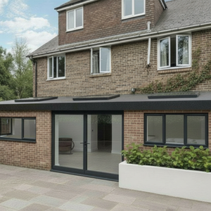Modern flat roof extension with glass doors and skylights