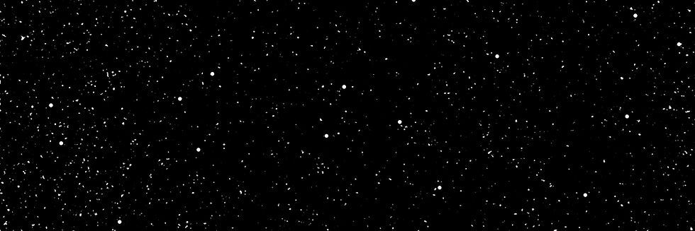 A dark void of space spotted with stars.