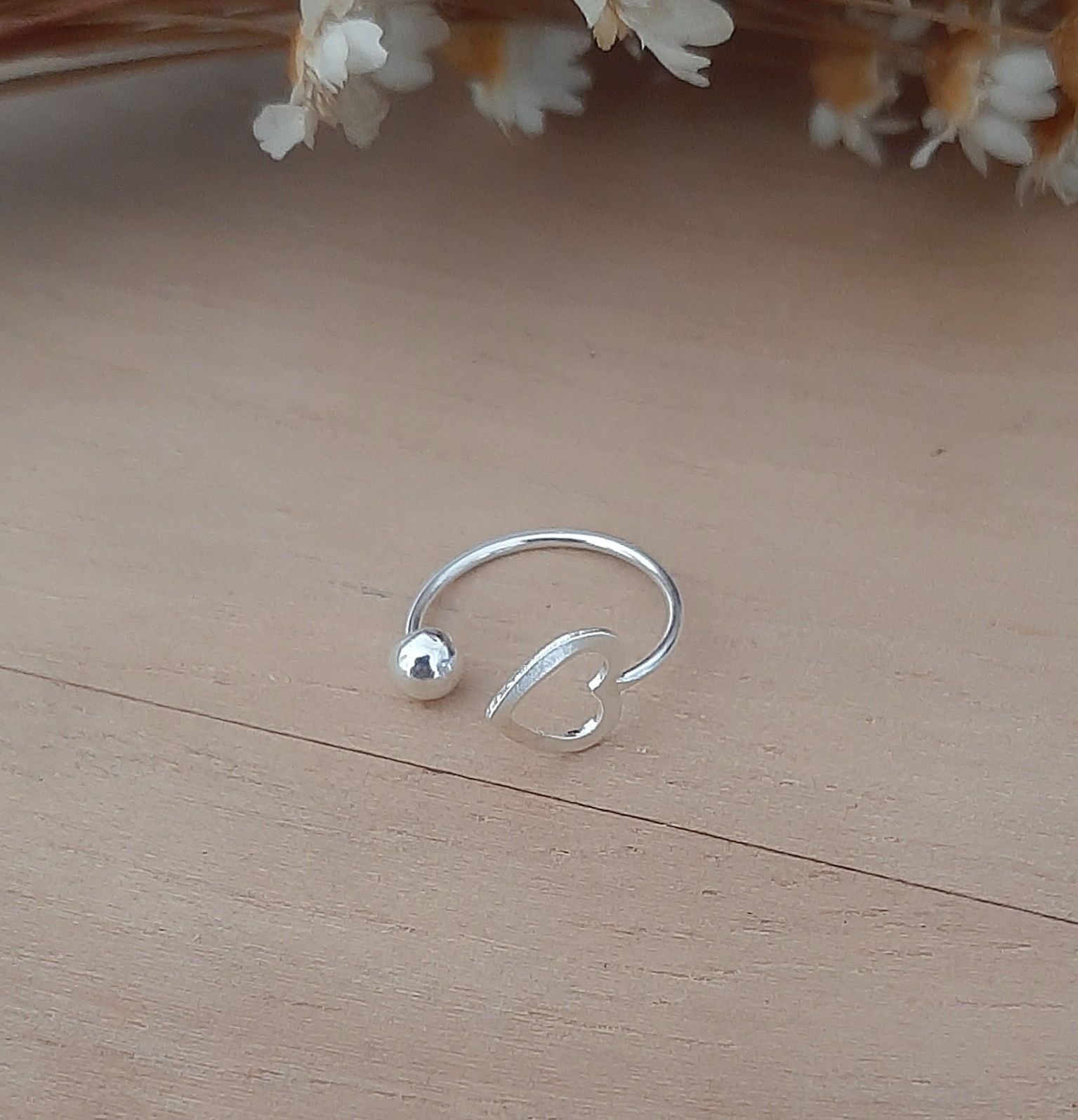 Piercing fake coração