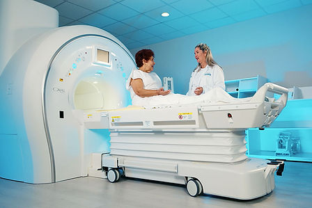 Medical technician operating an MRI machine at La Colonia Medical Center