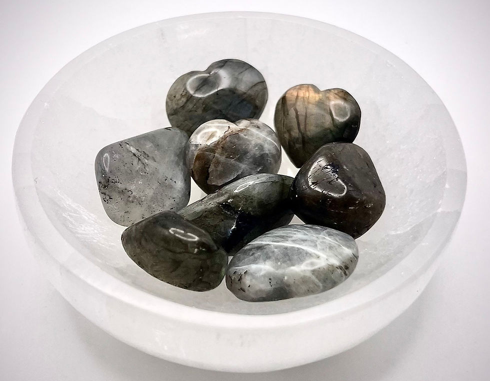 Tumbled labradorite stone showing labradorescence, a pocket talisman for travelers and empaths