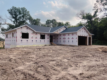 Residential home exterior framed and wrapped during new construction in Minnesota