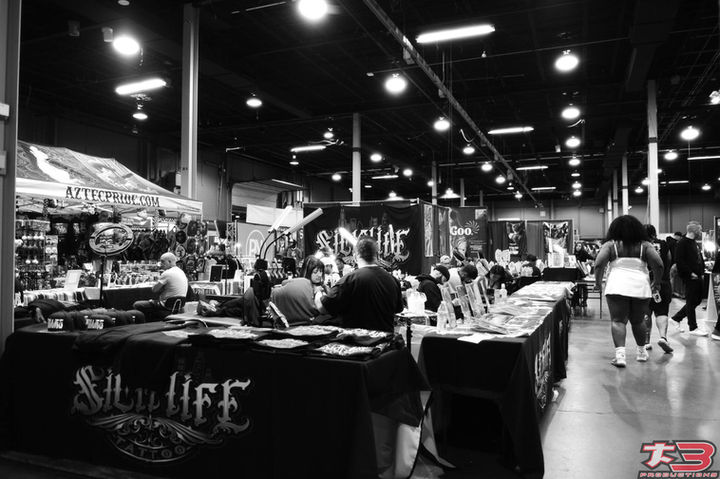 Tattoo artwork and merchandise display at Chicago Tattoo Arts Festival 2026 Villain Arts event