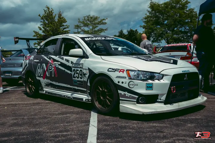 Custom white Mitsubishi performance car displayed at the Warrenville owners day car show