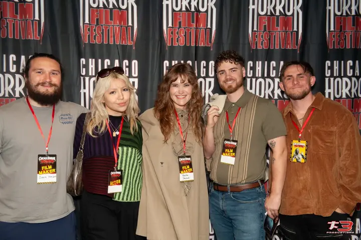 Group of five filmmakers and festival participants wearing event badges at the 28th Chicago Horror Film Festival in Chicago.