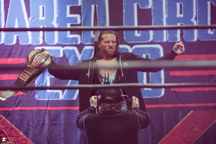 Professional wrestler entrance and championship presentation at Squared Circle Expo 2026