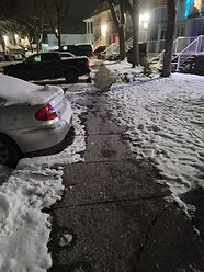 Slippery underground parkade ramp in Chilliwack covered in snow and ice before residential service from a snow removal contractor