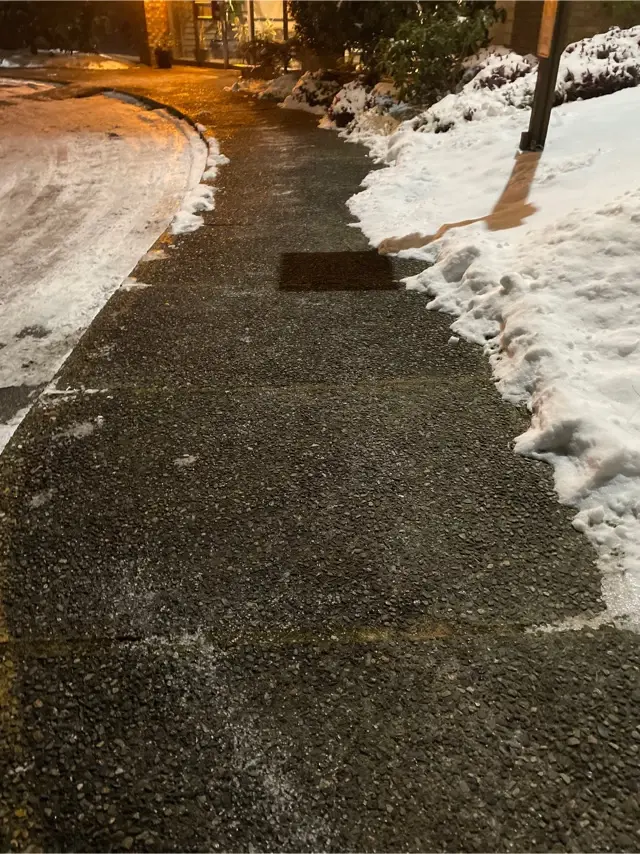 Sidewalk cleared of snow and ice after winter maintenance.