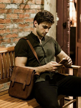 Vladimir Grand, a Philippine based host, actor, model, and digital content creator wearing the Messenger Leather Bag from S.O.S. @callmegrand is his Instagram username