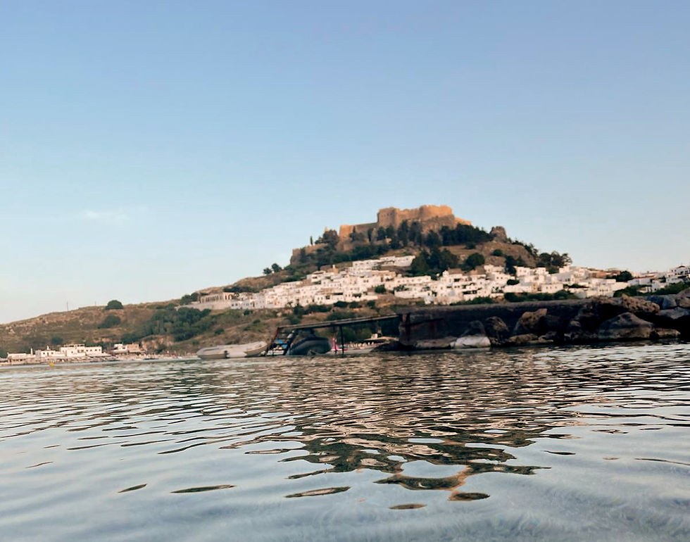 Lindos village and Acropolis as seen from near Lindos Heart Parking – closest parking to Lindos beach and the town center, with secure 24/7 access and easy walk to main attractions.