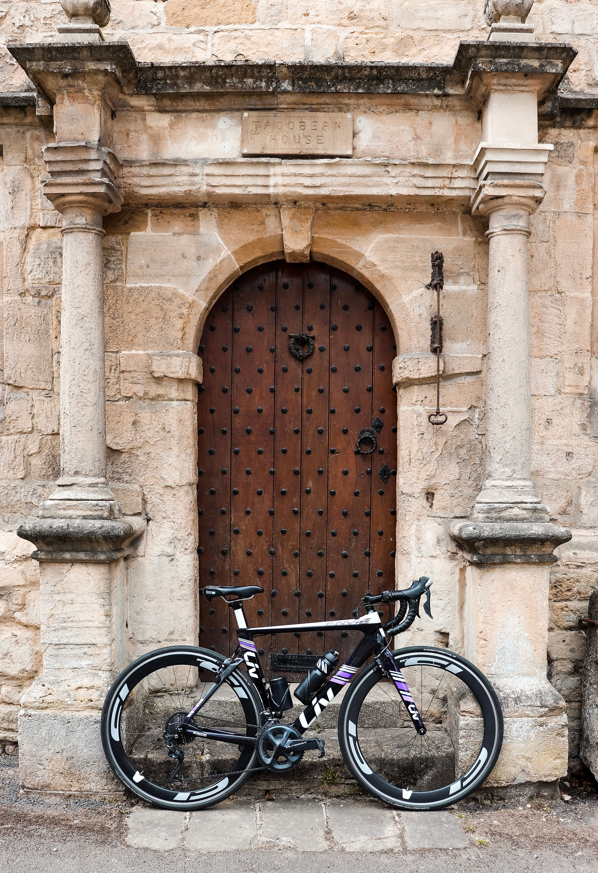 Road bike in a traditional Cotswolds village