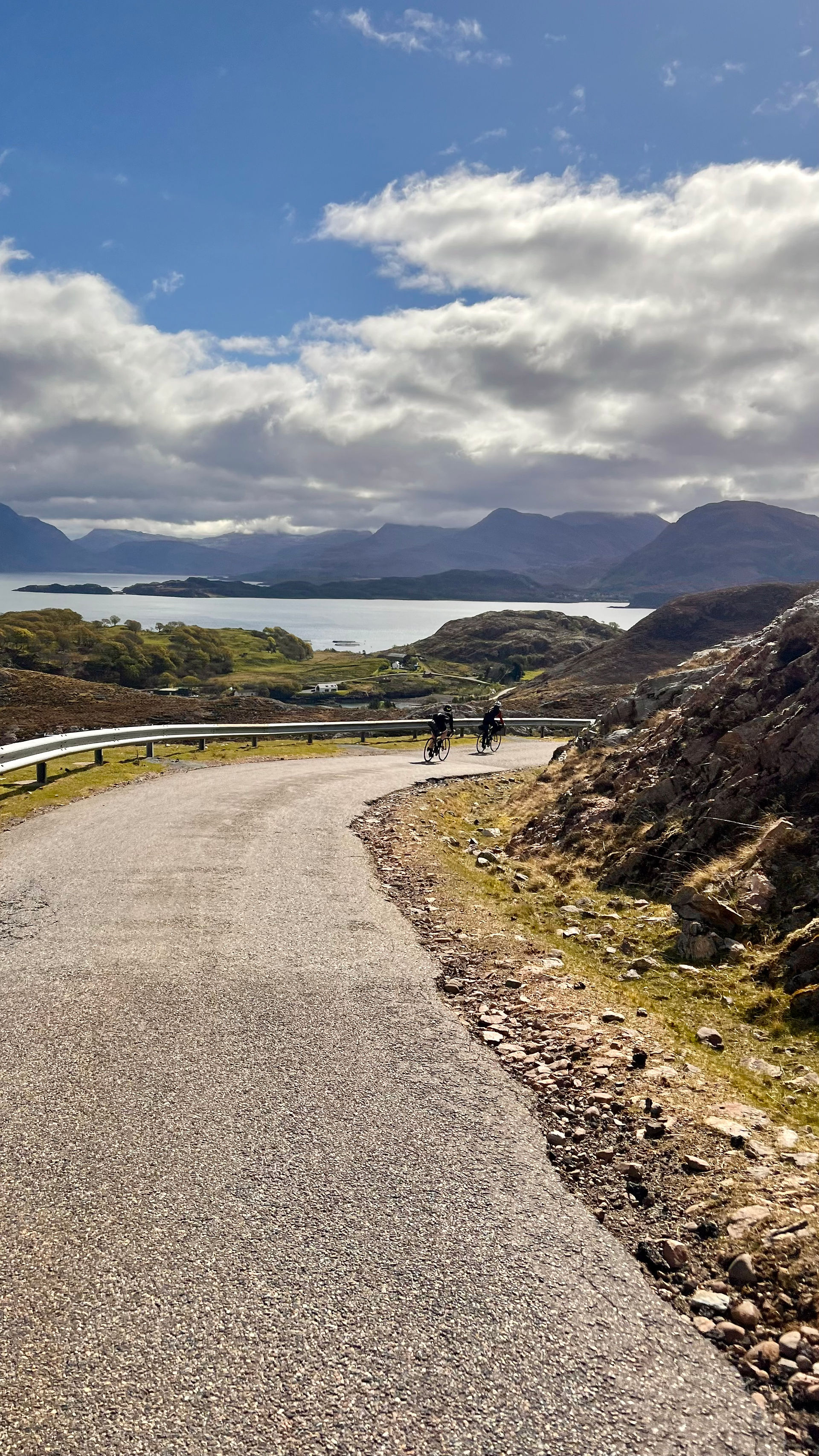 cyclist on a road in Scotland on the classic North Coast 500