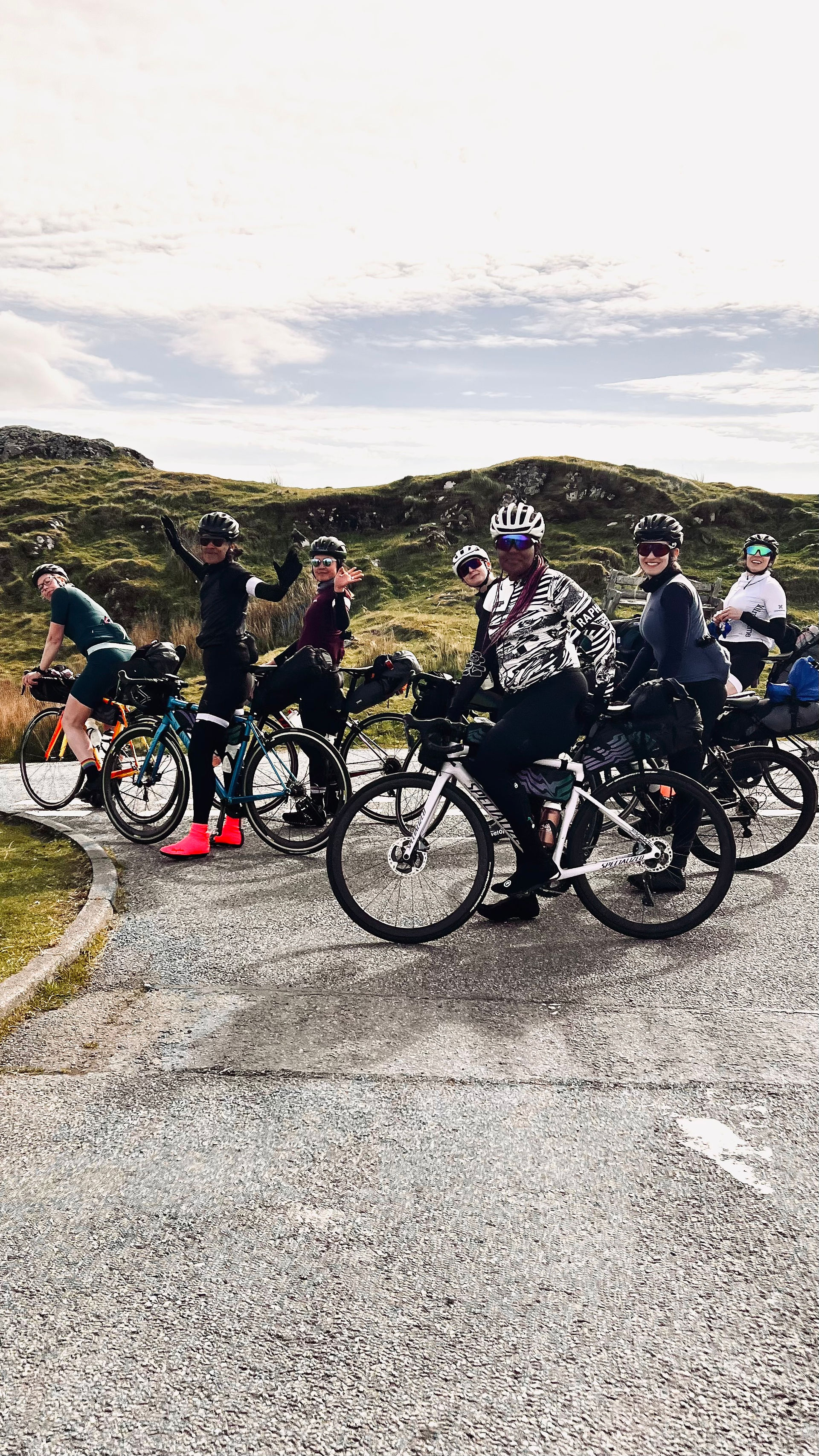 cyclists on a road in Scotland on the classic North Coast 500