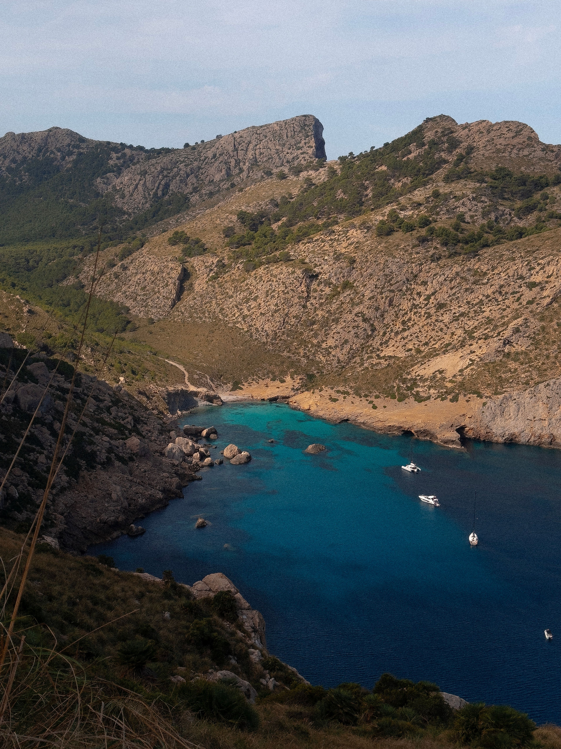 View of a mountain and lake during girls cycling trip in Mallorca
