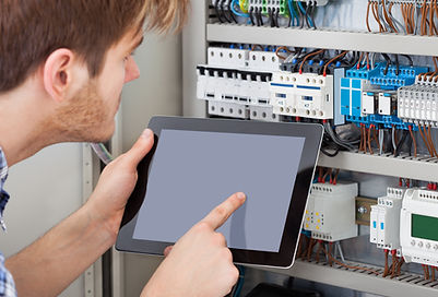 Side view of male technician examining f