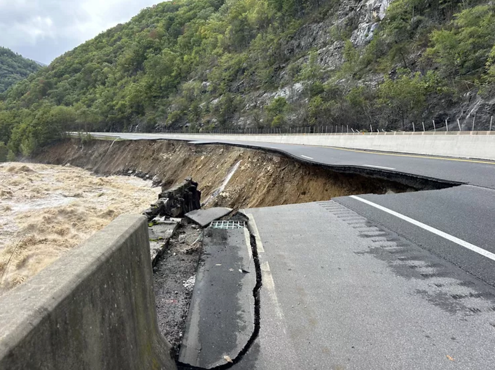 A photo showing a section of Interstate 40 completely wiped out by floodwaters.