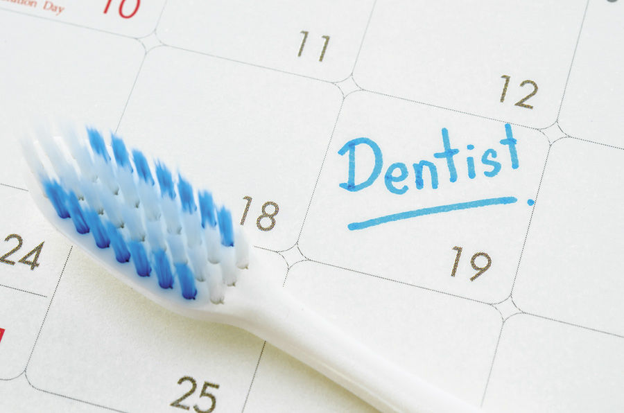 Concept image of toothbrush and calendar reminder