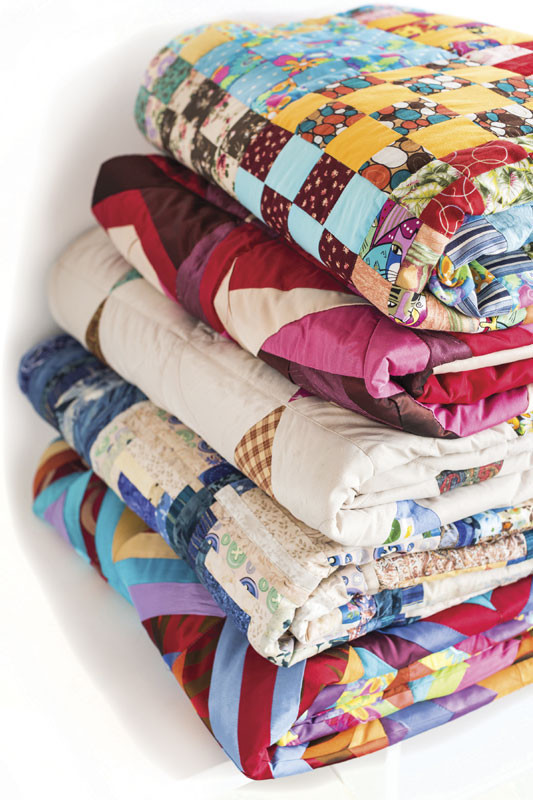 a stack of quilts