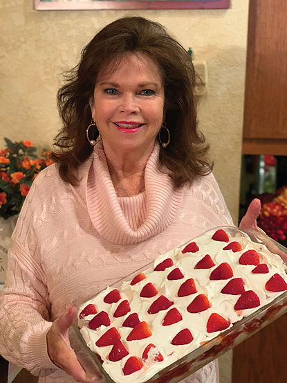 woman holding strawberry pizza