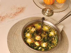 Winter greens & garlic soup with rosemary turkey balls