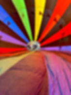 the inside of a hot air balloon with black and multicolor stripes
