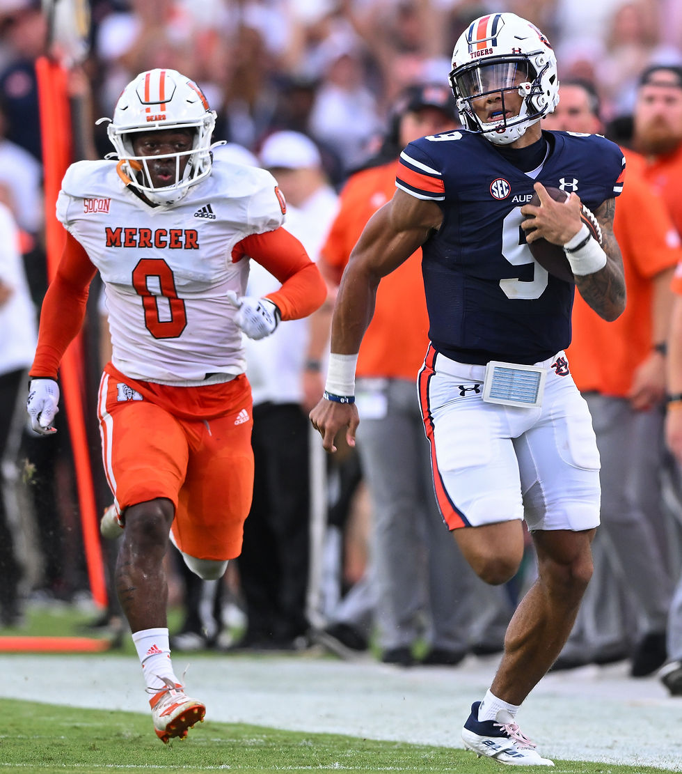 Auburn quarterback Robby Ashford runs down the sideline for a 49-yard gain against Mercer.